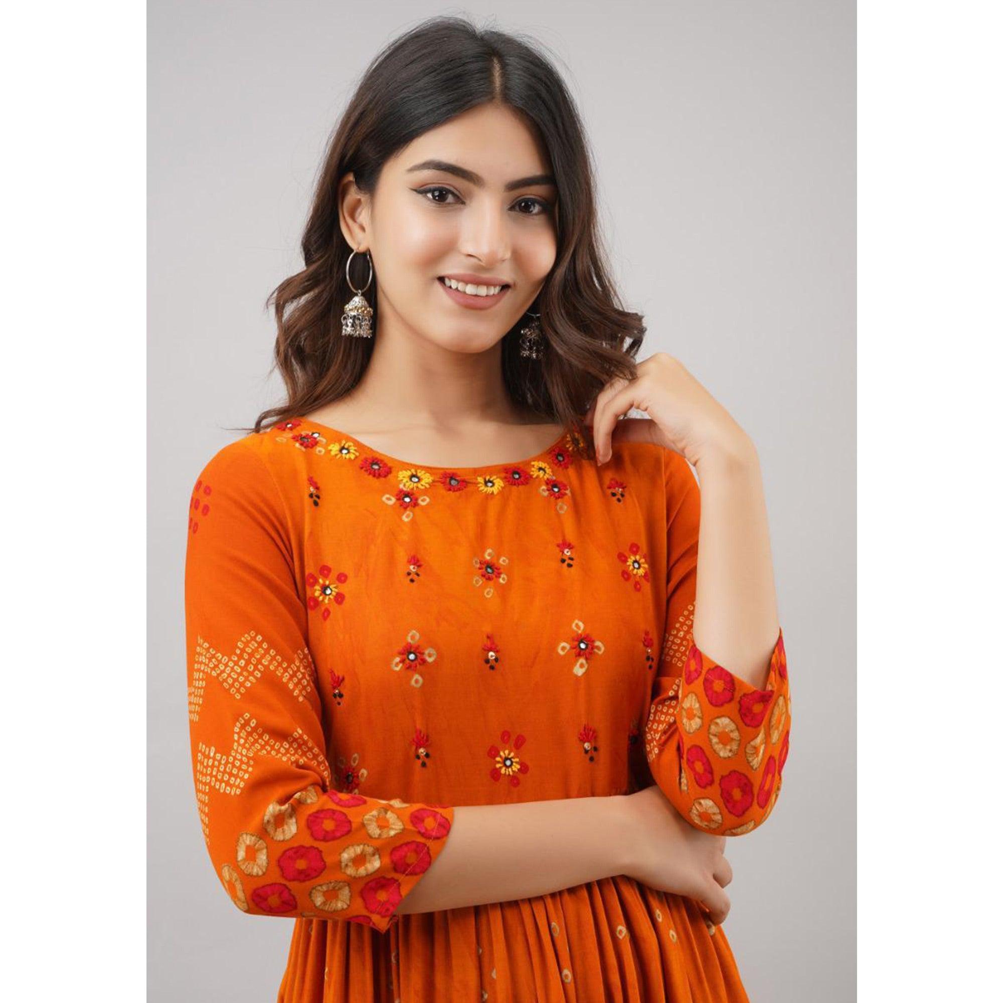 impressive orange colored partywear embroidered muslin long kurti peachmode 2